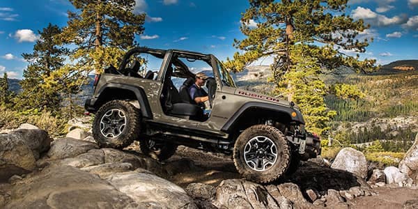 four wheel drive vehicle traversing rocks